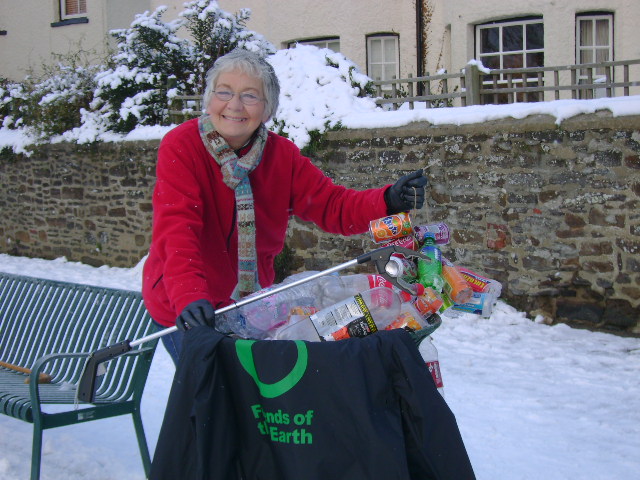 Member Annie collecting litter from the park, for the new recycling bin